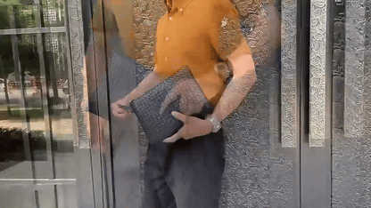 Pochette à main pour homme